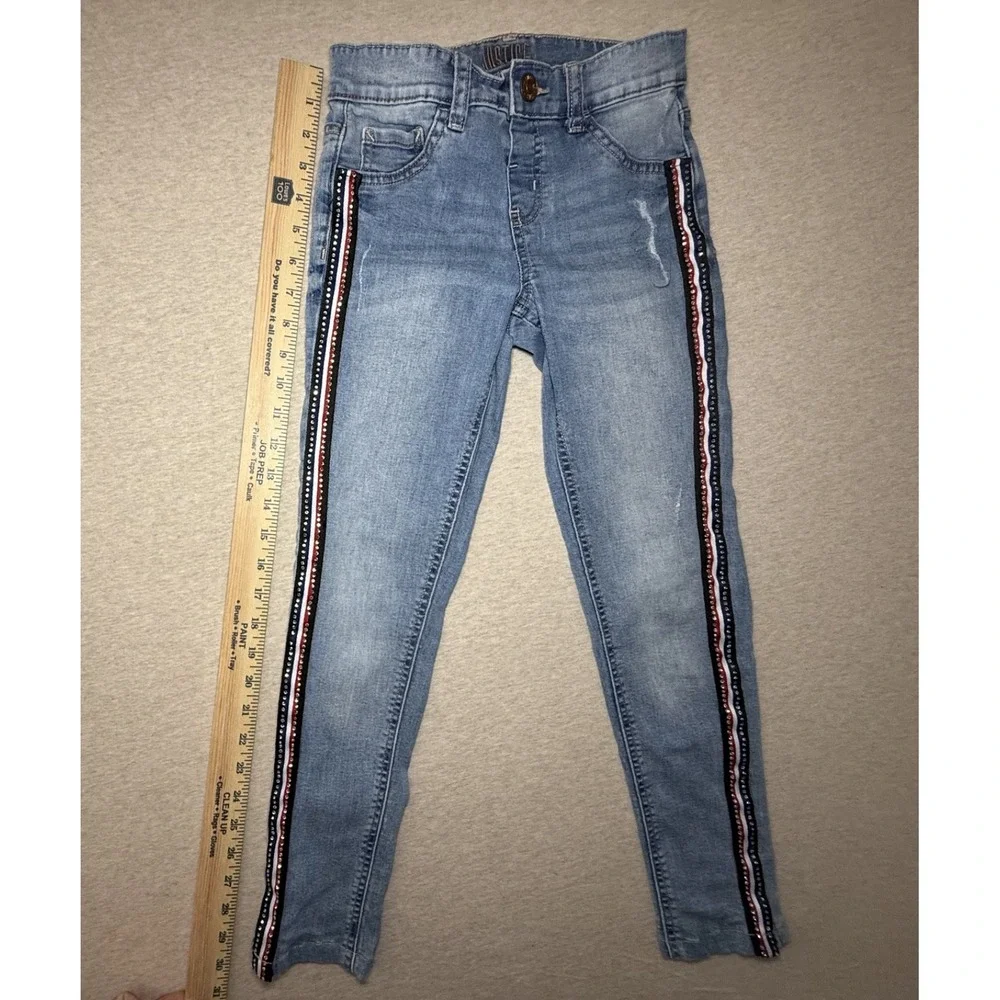 Justice. girl size 10. blue jean with red white and blue side. 4th of july.